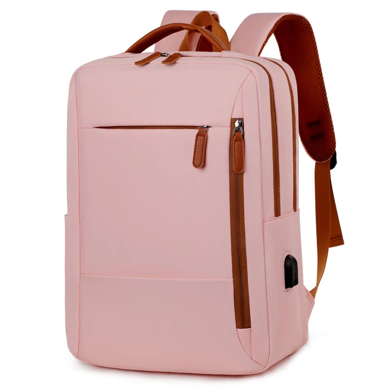 Pink backpack with brown straps on a white background