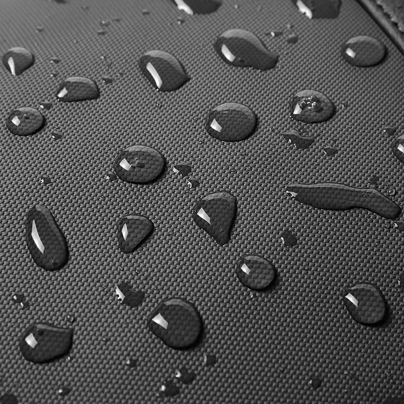 Water droplets on a textured black surface