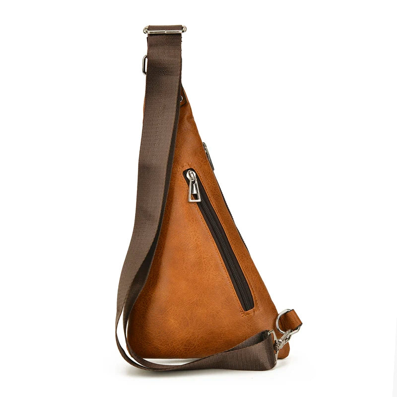 Brown sling bag with a visible zipper on a white background