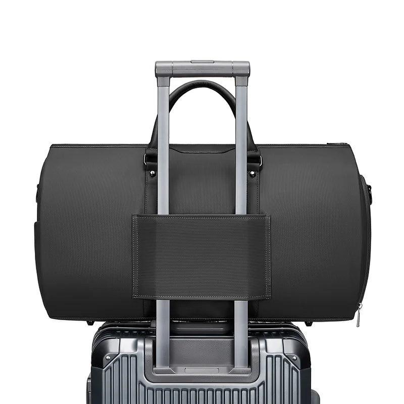 Black duffel bag with handle and wheels on a white background