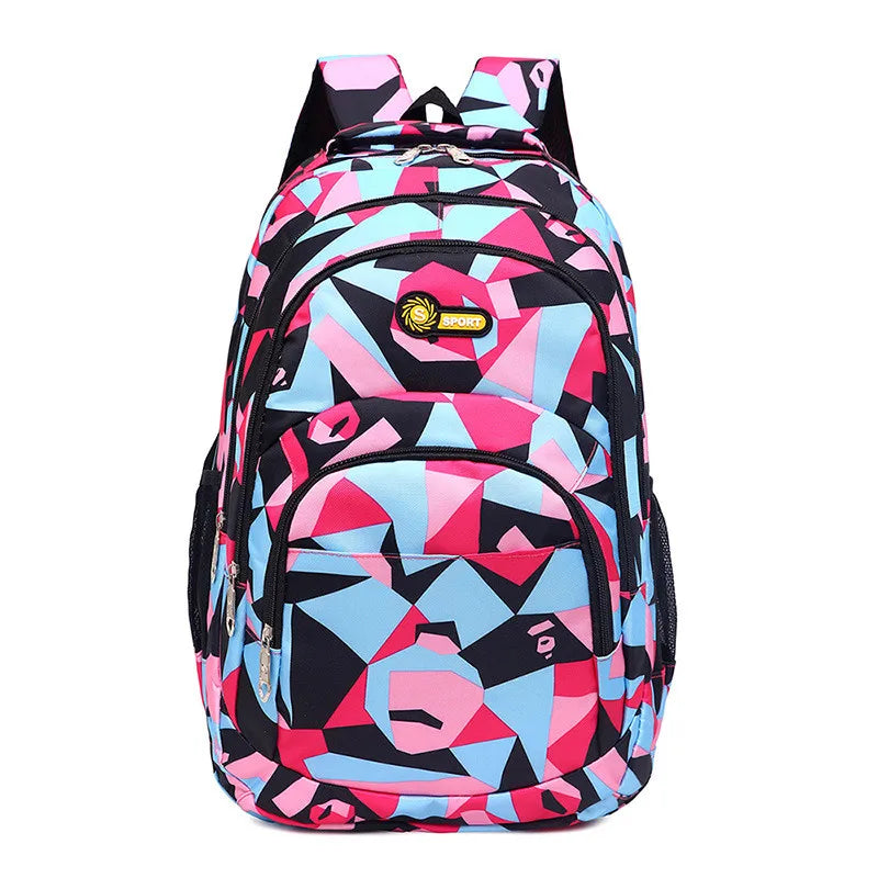 Colorful geometric-patterned backpack on a white background
