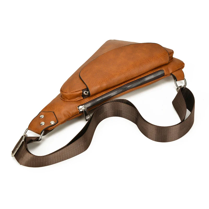 Brown leather sling bag with a strap on a white background