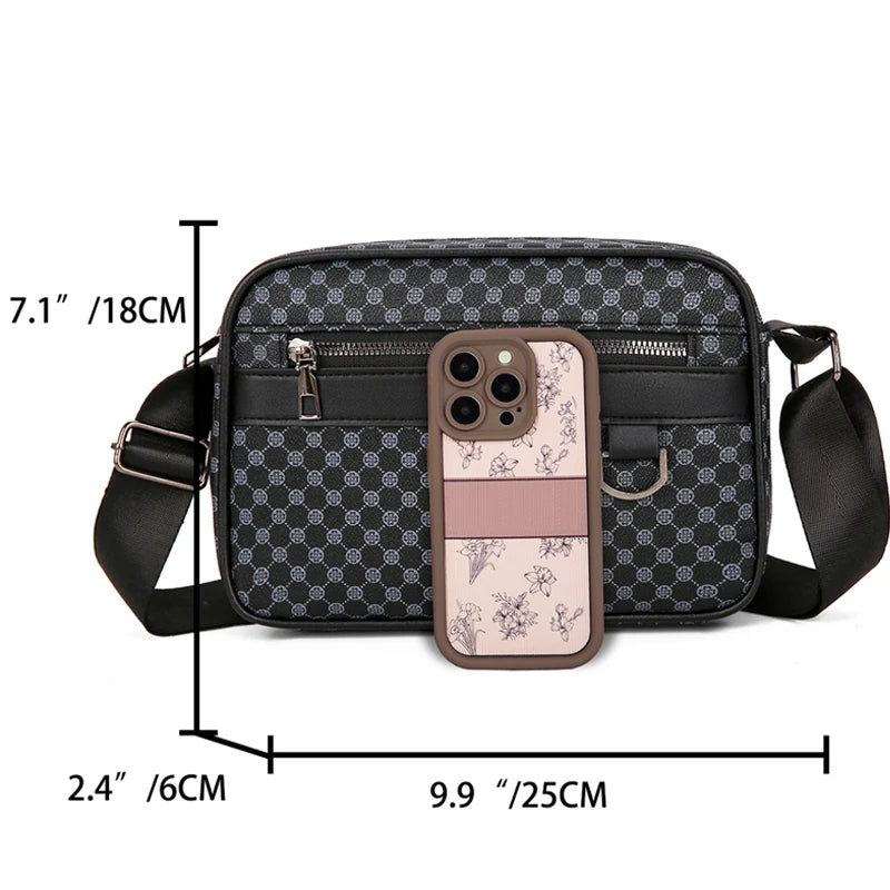 Black patterned crossbody bag with measurements and a phone case on a white background