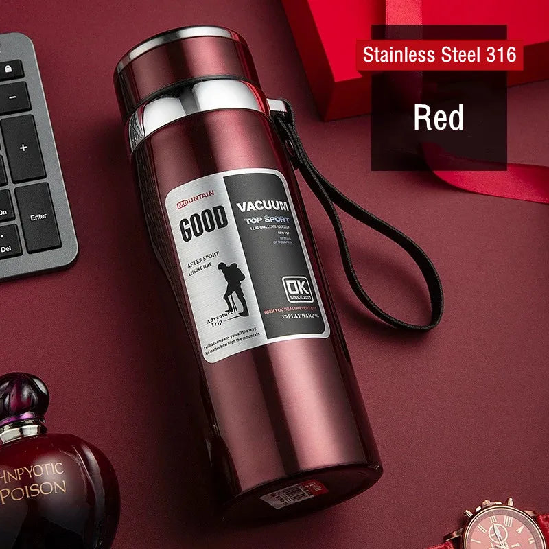 Red stainless steel vacuum bottle with a label on a red background