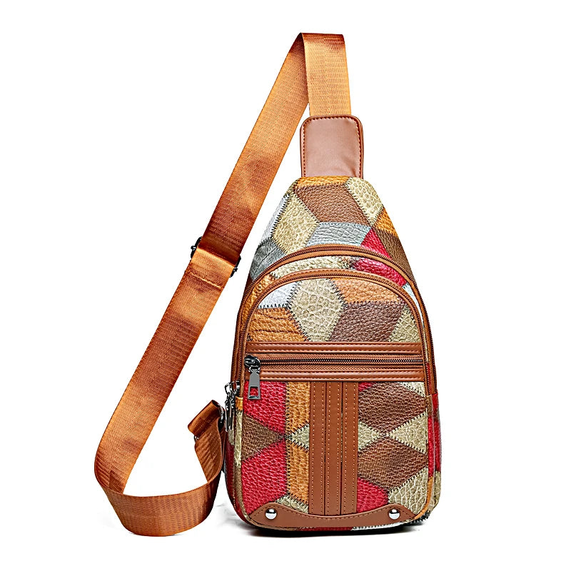 Multicolored patterned sling bag with brown strap on a white background