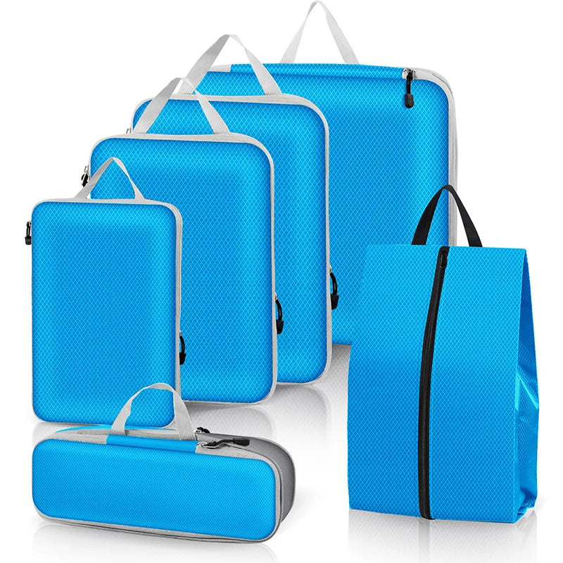 Set of blue packing cubes with handles on a white background