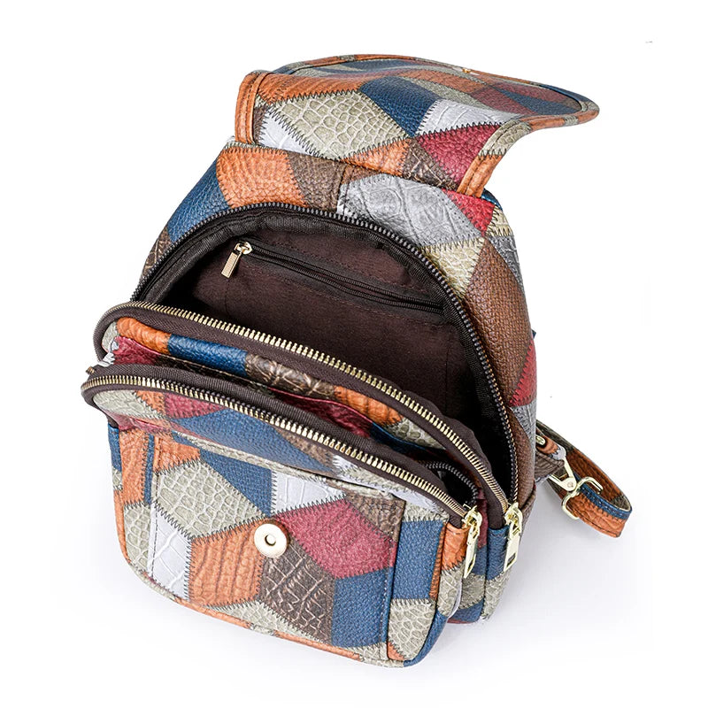 Multicolored patchwork backpack with open front pocket on a white background