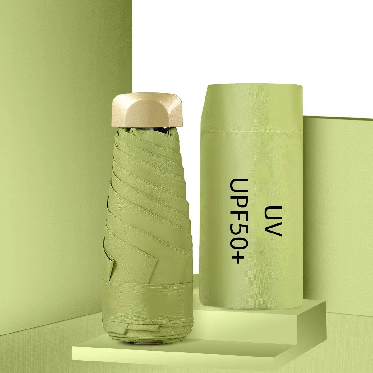 Green umbrella with 'UPF50+' text on a green background