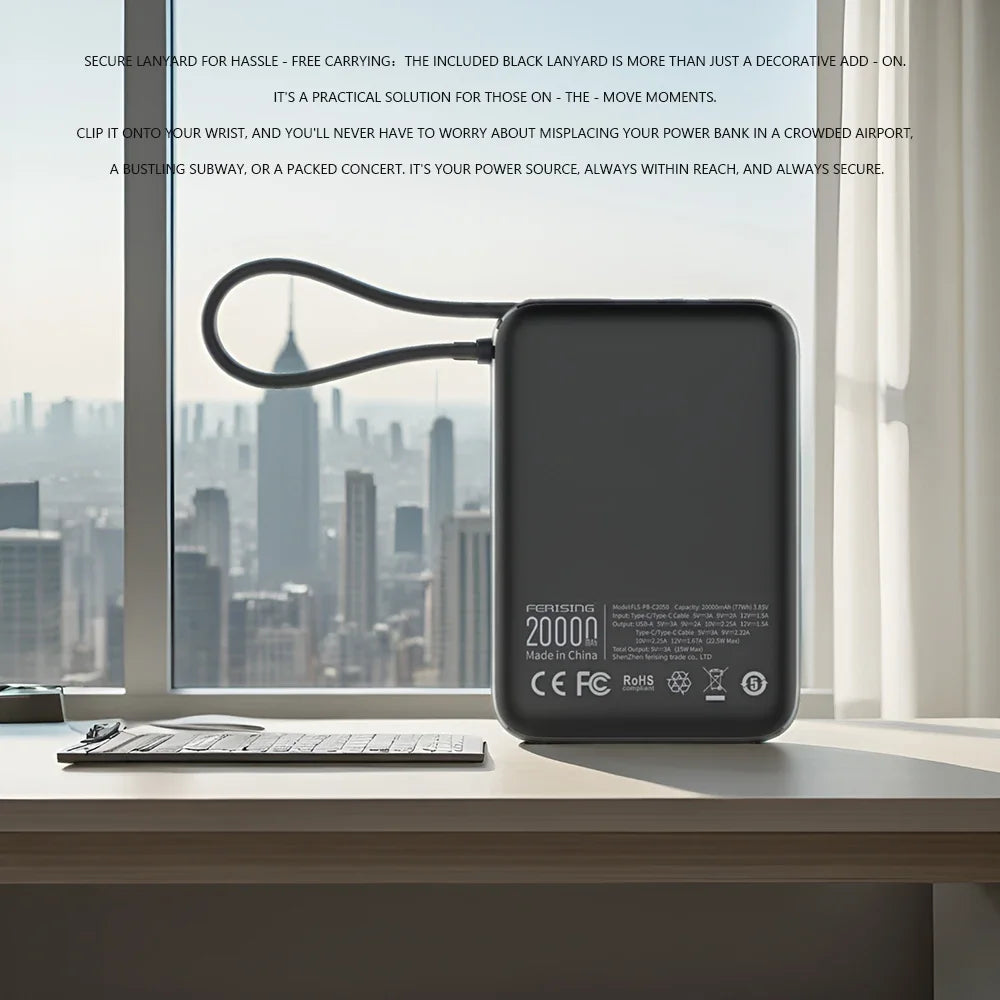 Black power bank on a desk with a cityscape view through a window