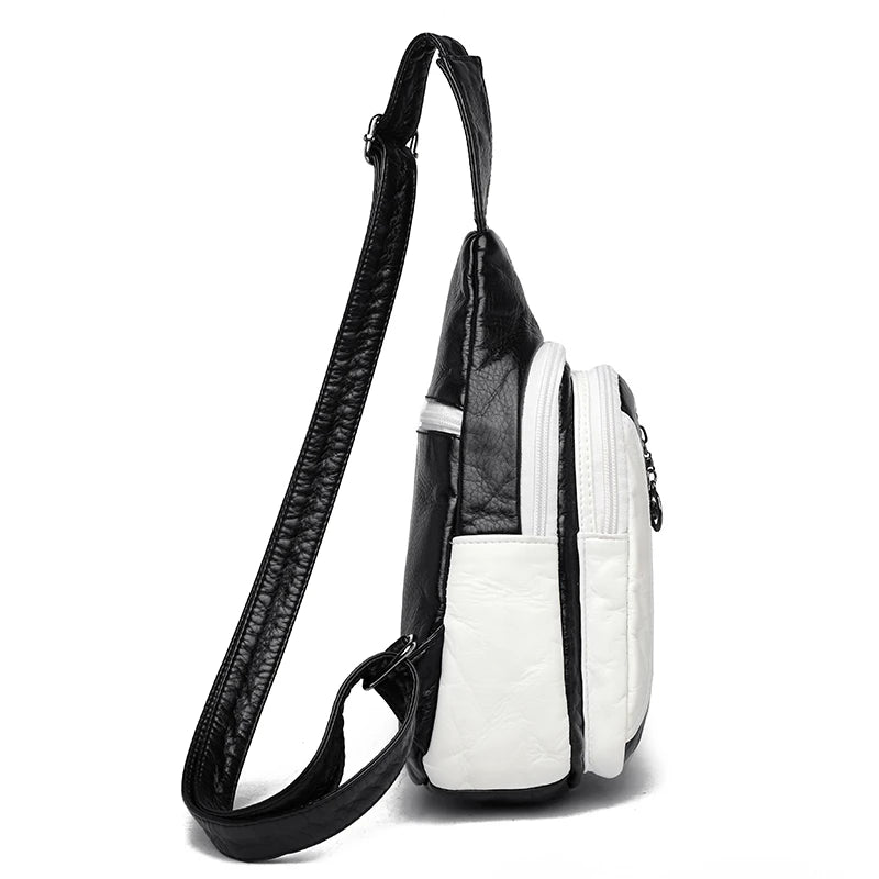 Black and white crossbody bag on a white background