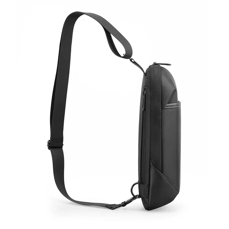 Black sling bag with a strap on a white background