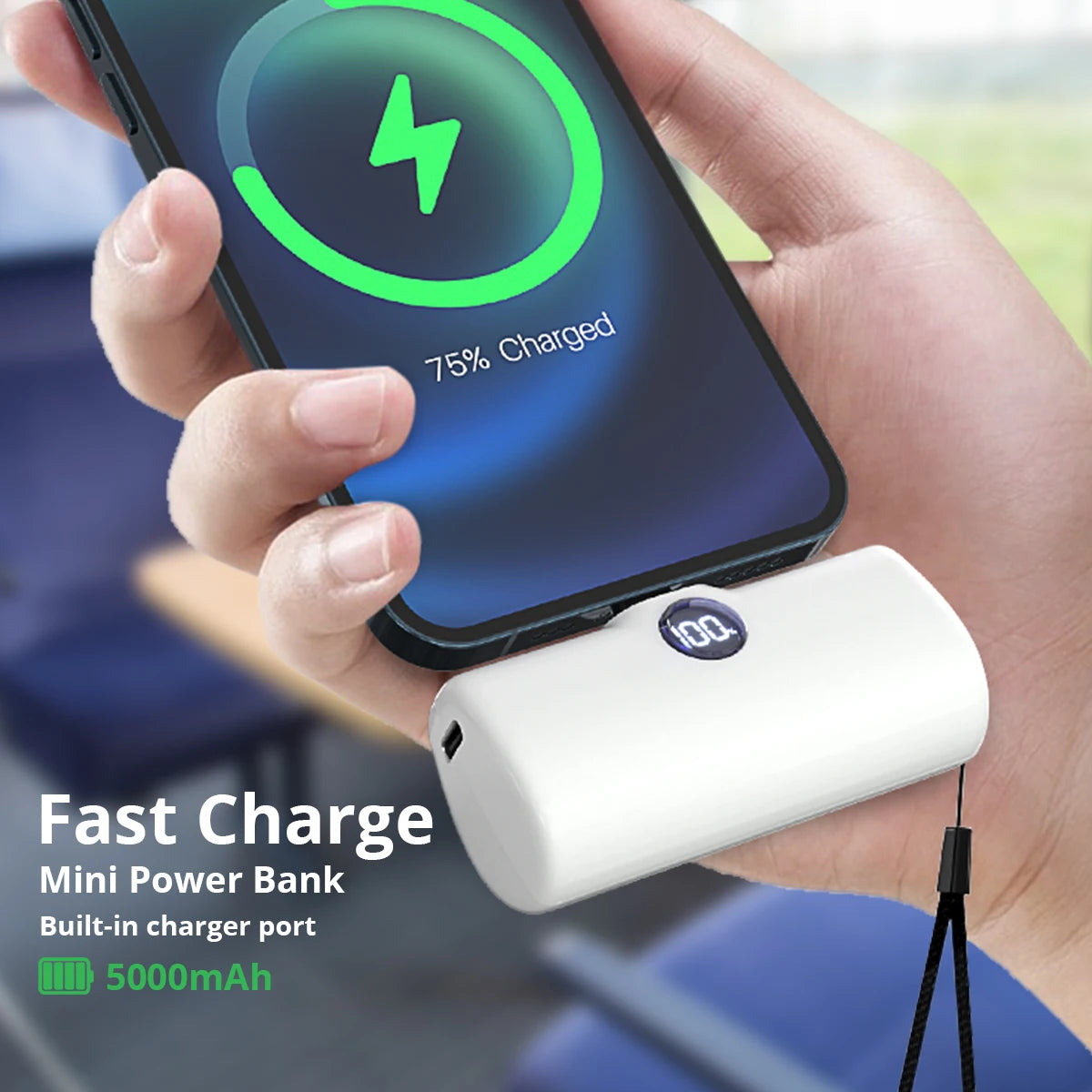 Hand holding a smartphone with a power bank attached, showing charging progress.