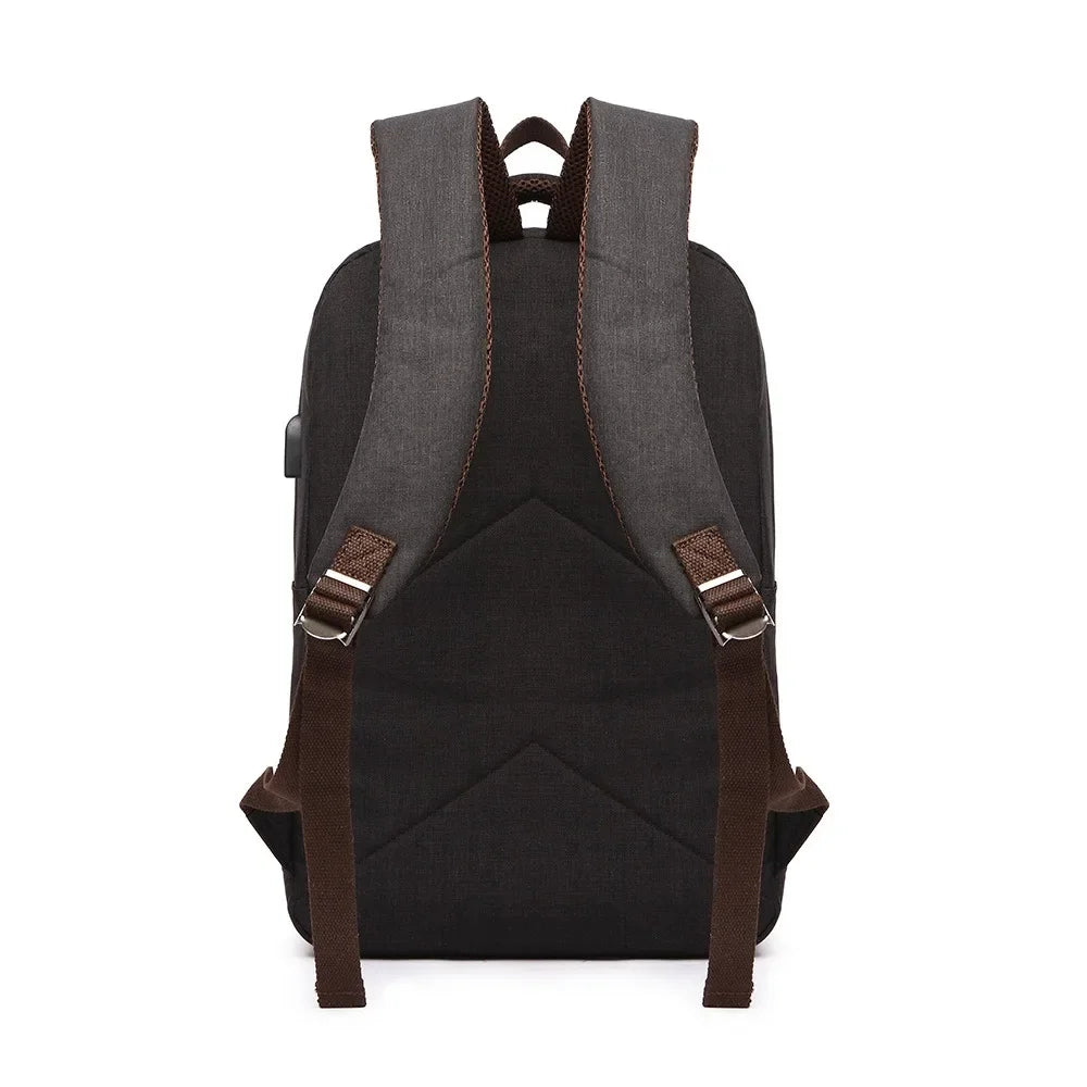 Black backpack with brown straps on a white background