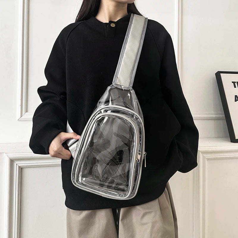 Person wearing a transparent backpack with a black sweater and beige pants indoors.