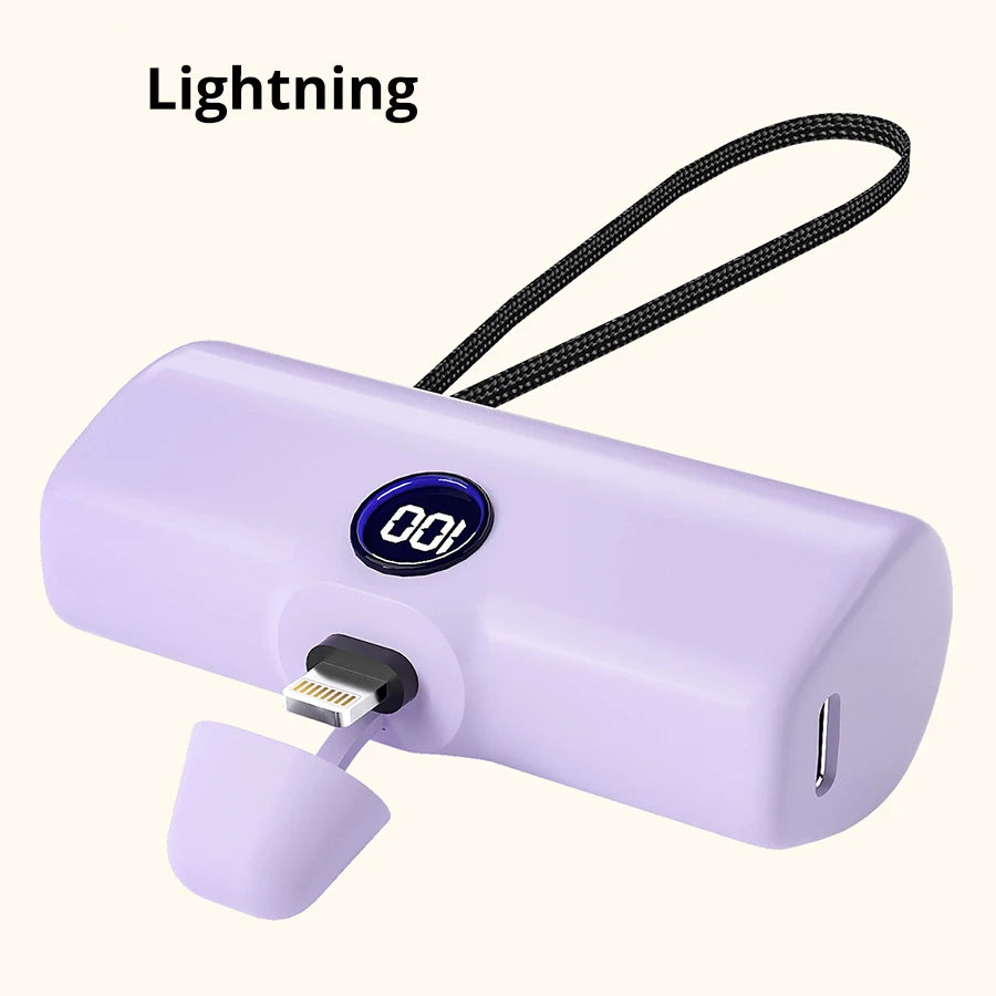 Purple power bank with digital display and Lightning connector on a white background