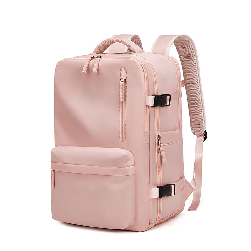Pink backpack with multiple pockets and straps on a white background