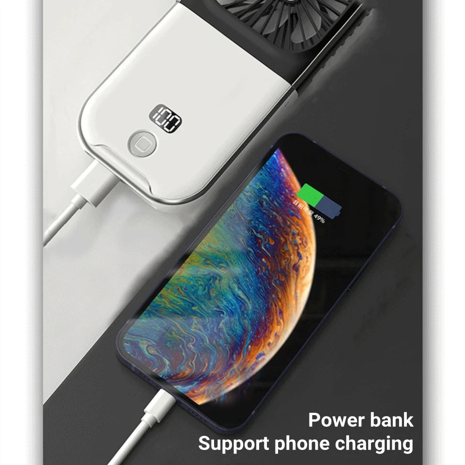 Power bank charging a smartphone on a dark surface