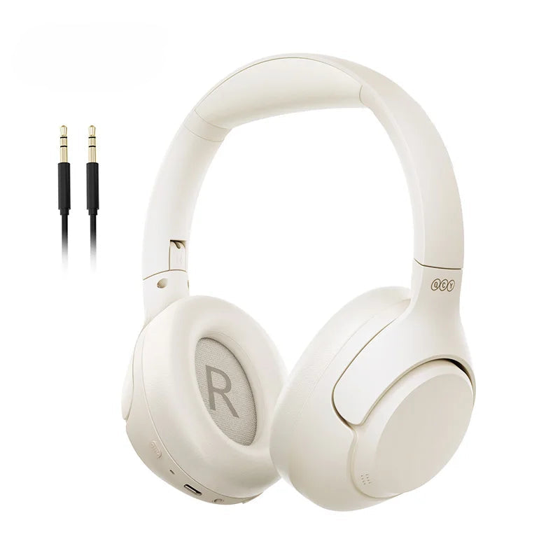 White headphones with QCY logo and audio cable on a white background