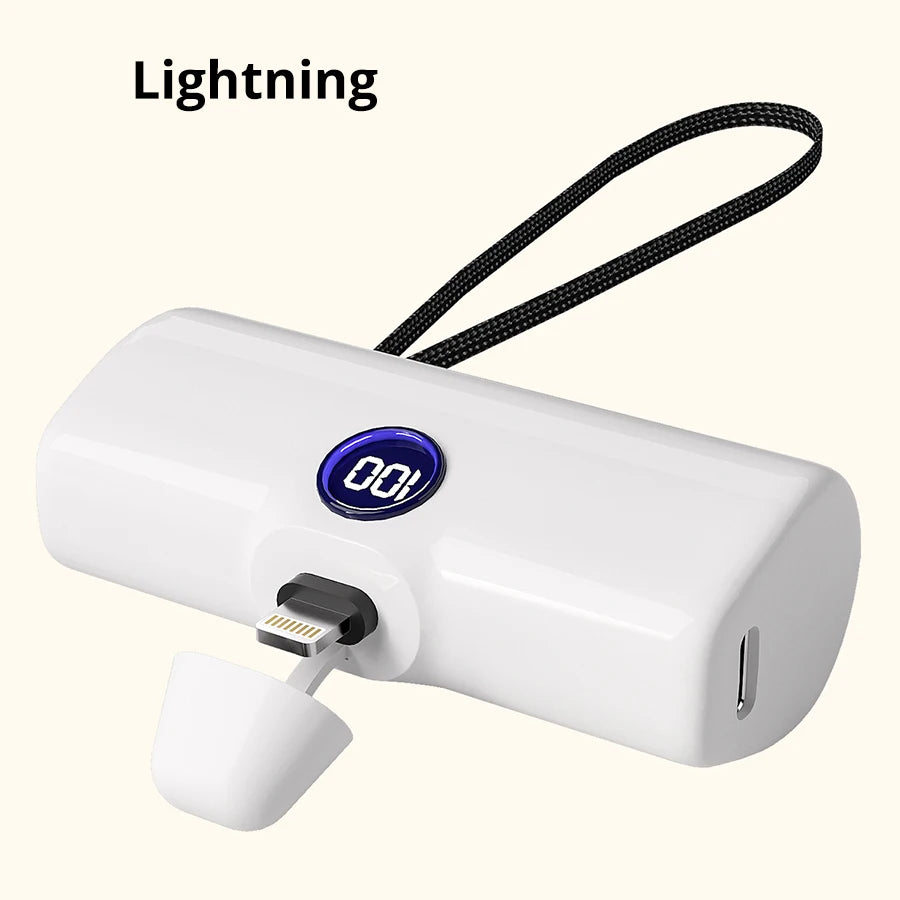 White power bank with digital display and Lightning connector on a white background