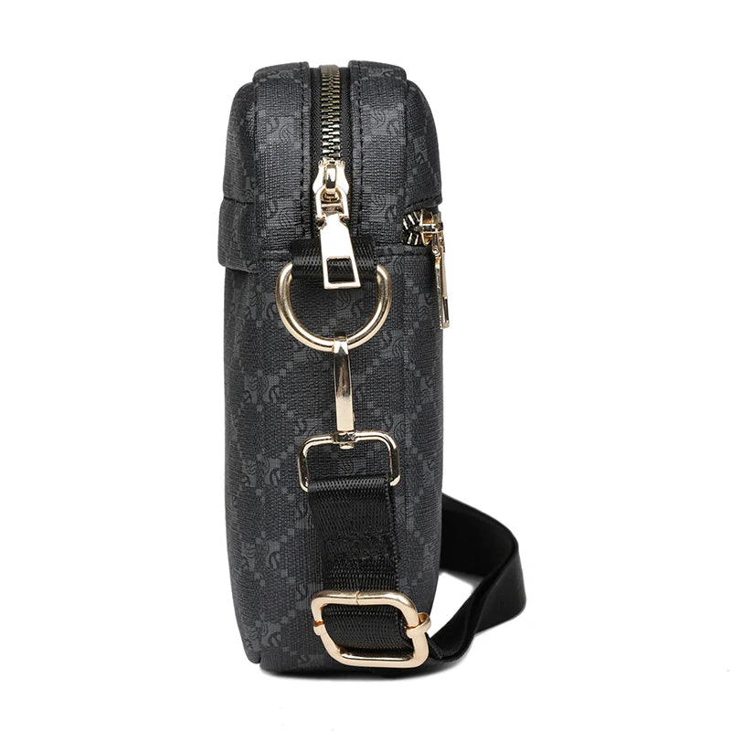 Black patterned bag with gold accents on a white background