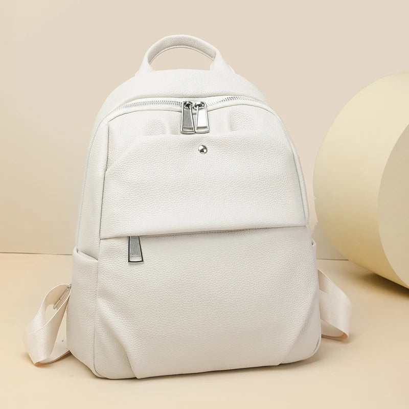 White backpack on a beige background