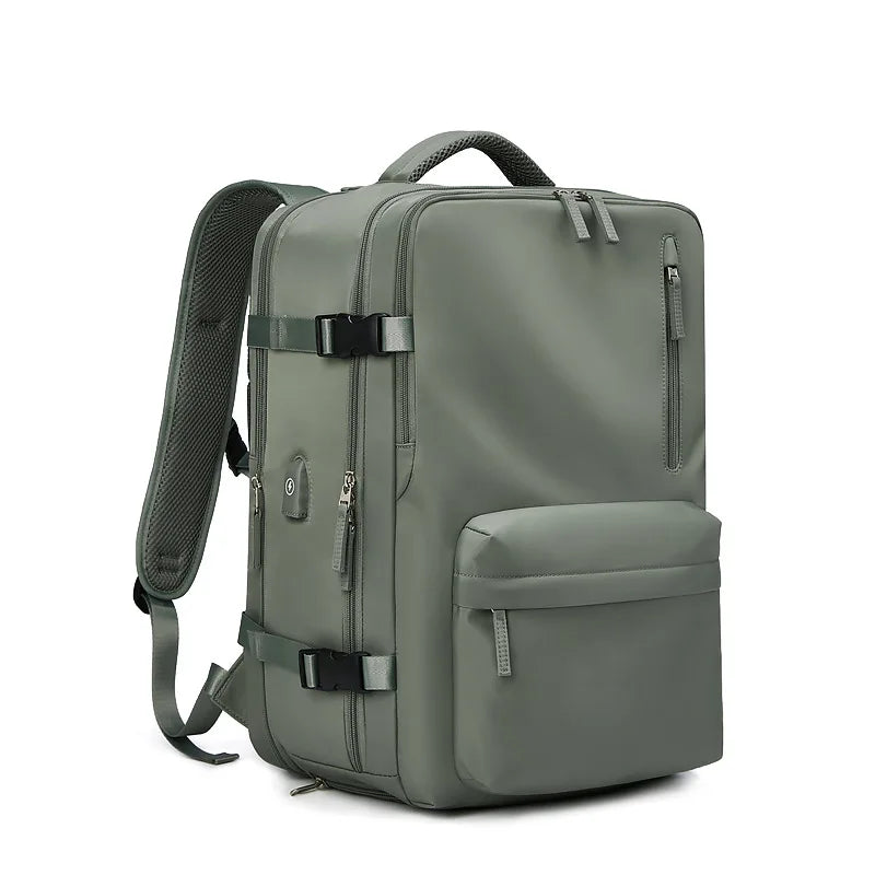 Green backpack with multiple pockets and straps on a white background