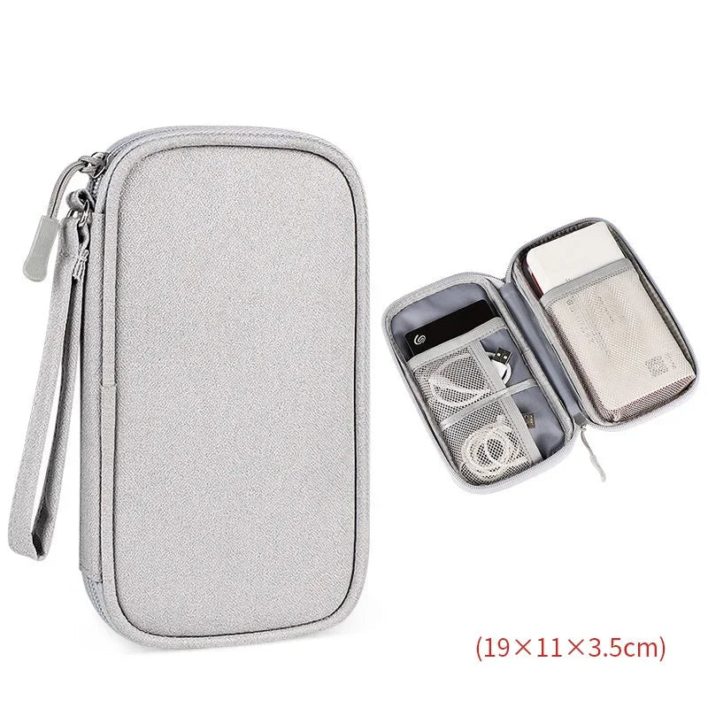 Gray travel organizer with compartments on a white background
