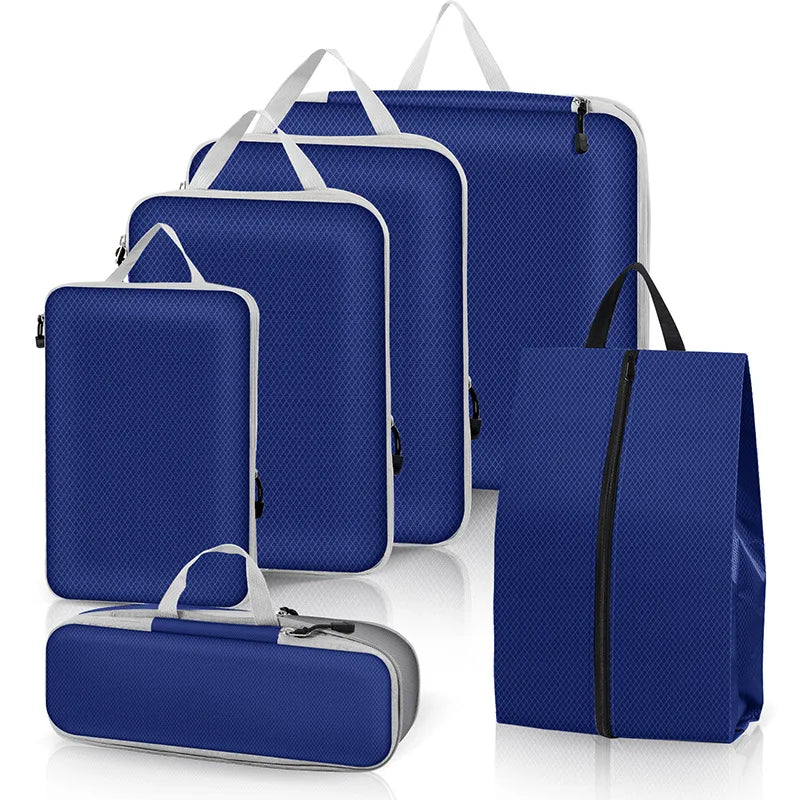 Set of blue packing cubes with various sizes on a white background