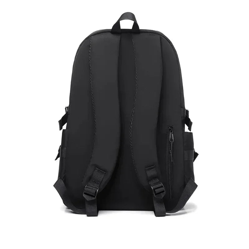 Black backpack shown from the back on a white background