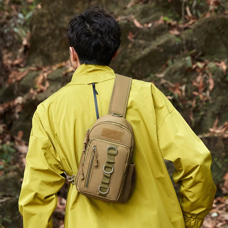Person wearing a yellow jacket and tan backpack in a forest setting