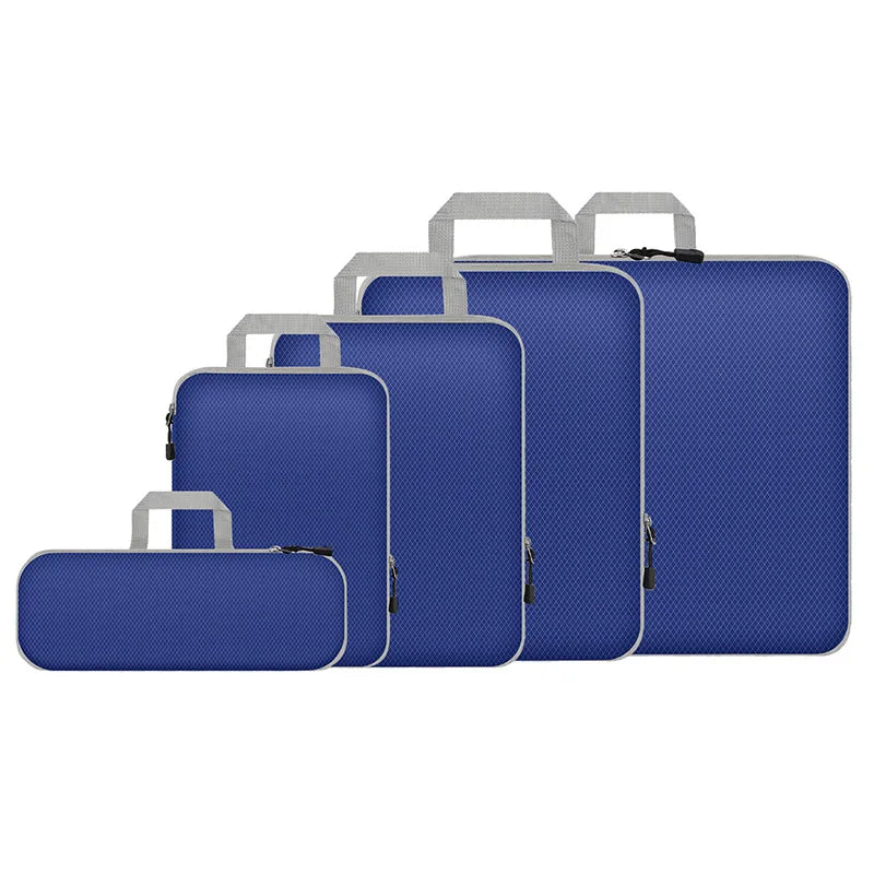 Set of blue luggage bags with silver handles on a white background