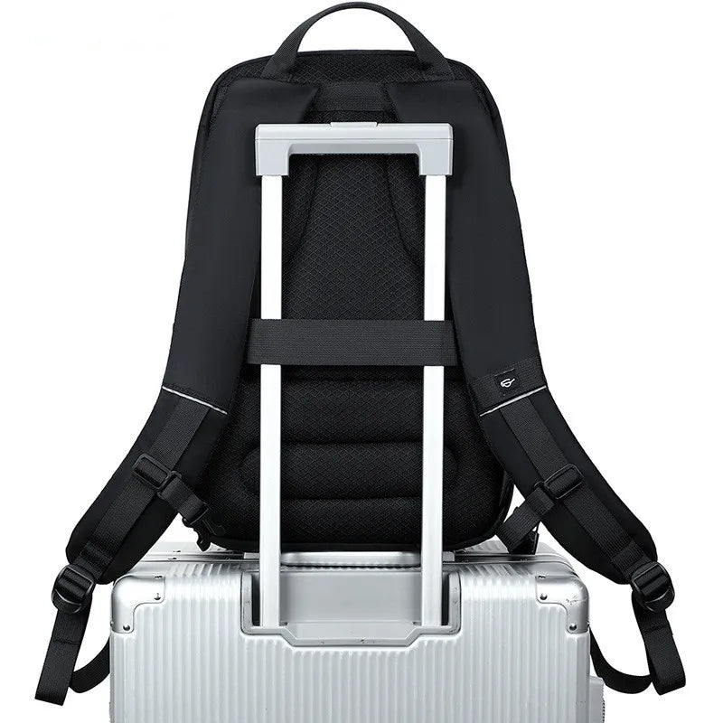 Black backpack with a luggage handle on a white background