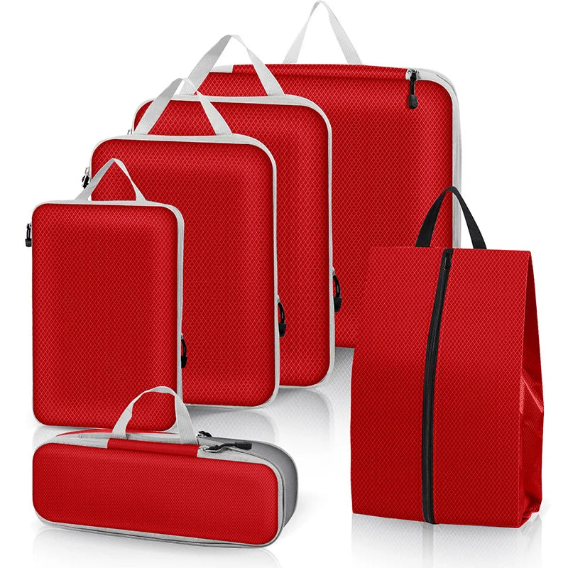 Set of red travel bags with various sizes on a white background
