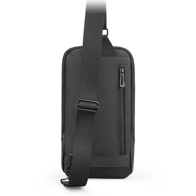 Black shoulder bag with a strap on a white background