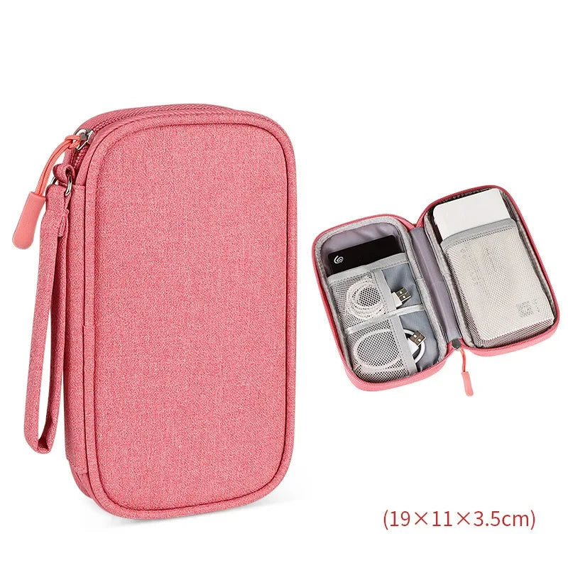 Pink travel organizer with compartments on a white background