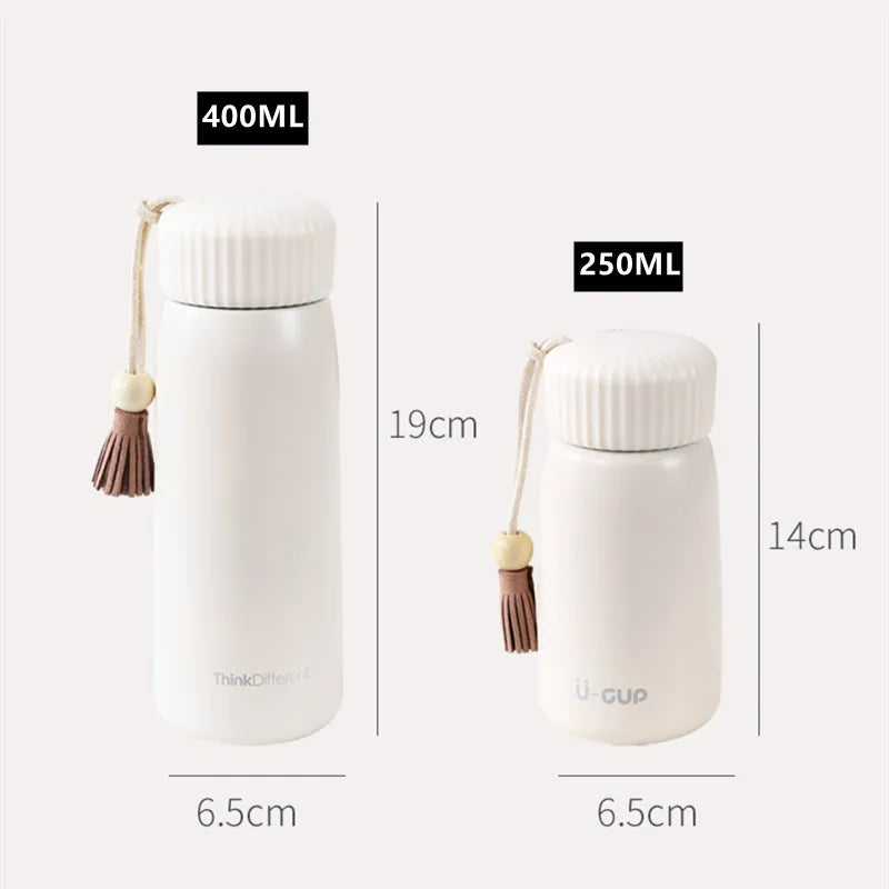 Two white thermos bottles with tassels, labeled for capacity and dimensions, on a light gray background.