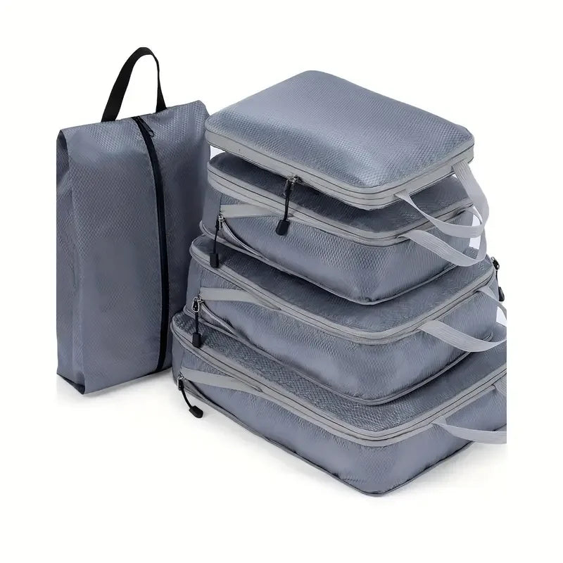 Set of gray packing cubes with a backpack on a white background