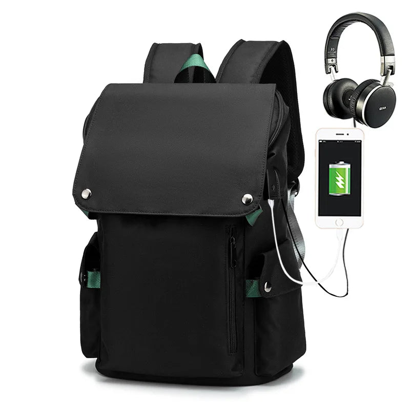 Black backpack with USB charging port, smartphone, and headphones on a white background