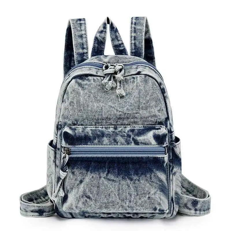 Denim backpack with front pocket on a white background