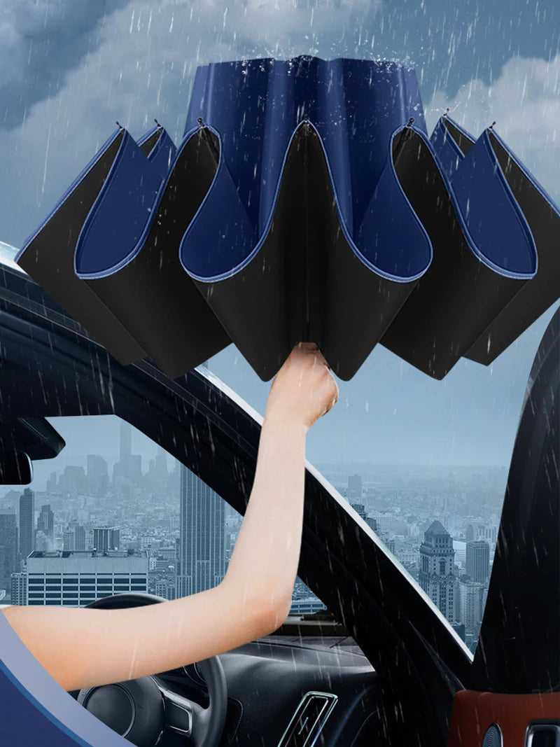 Person holding a car sunshade over a car's windshield with a cityscape in the background