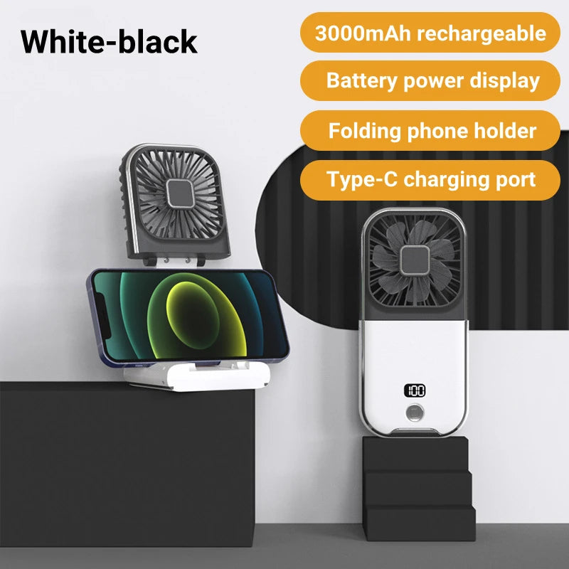 White-black portable phone holder with fan and charging port on a gray background