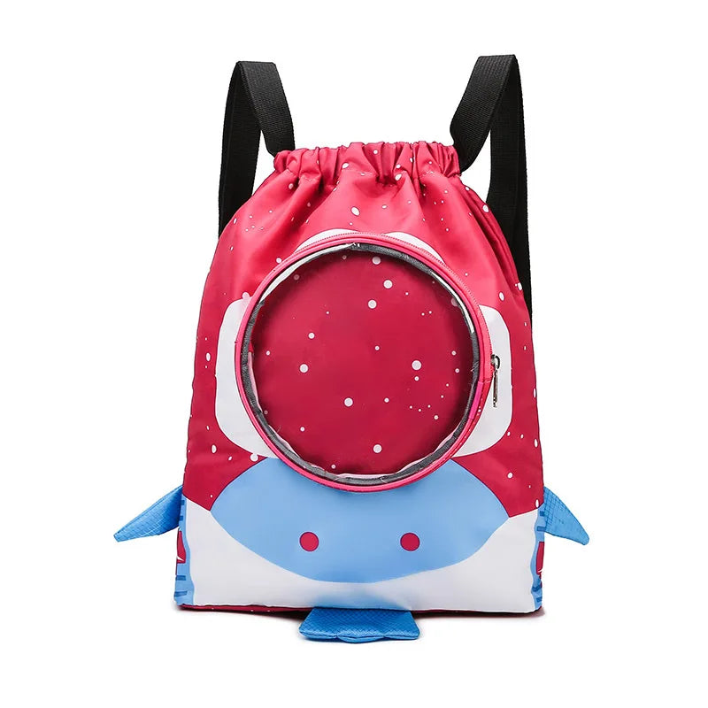 Pink drawstring bag with blue shark design on a white background