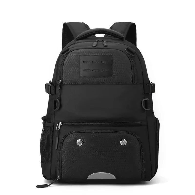 Black backpack with multiple pockets and straps on a white background