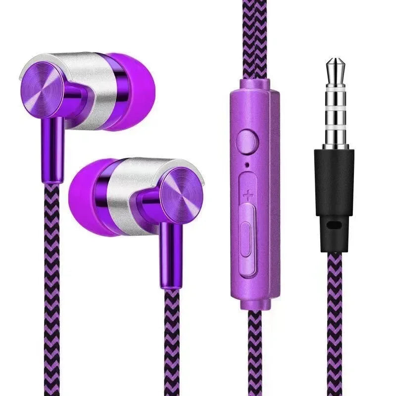 Purple and silver earphones with control button on a white background