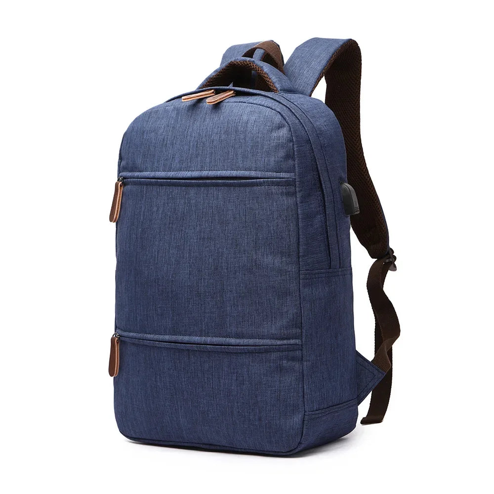 Blue denim backpack with brown accents on a white background