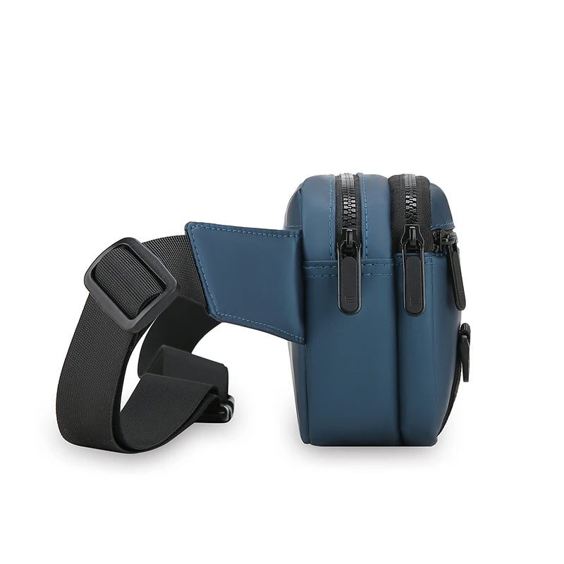 Blue crossbody bag with black strap on a white background