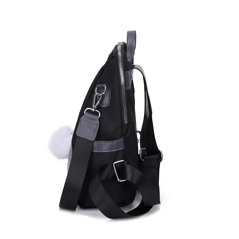 Black backpack with a strap on a white background