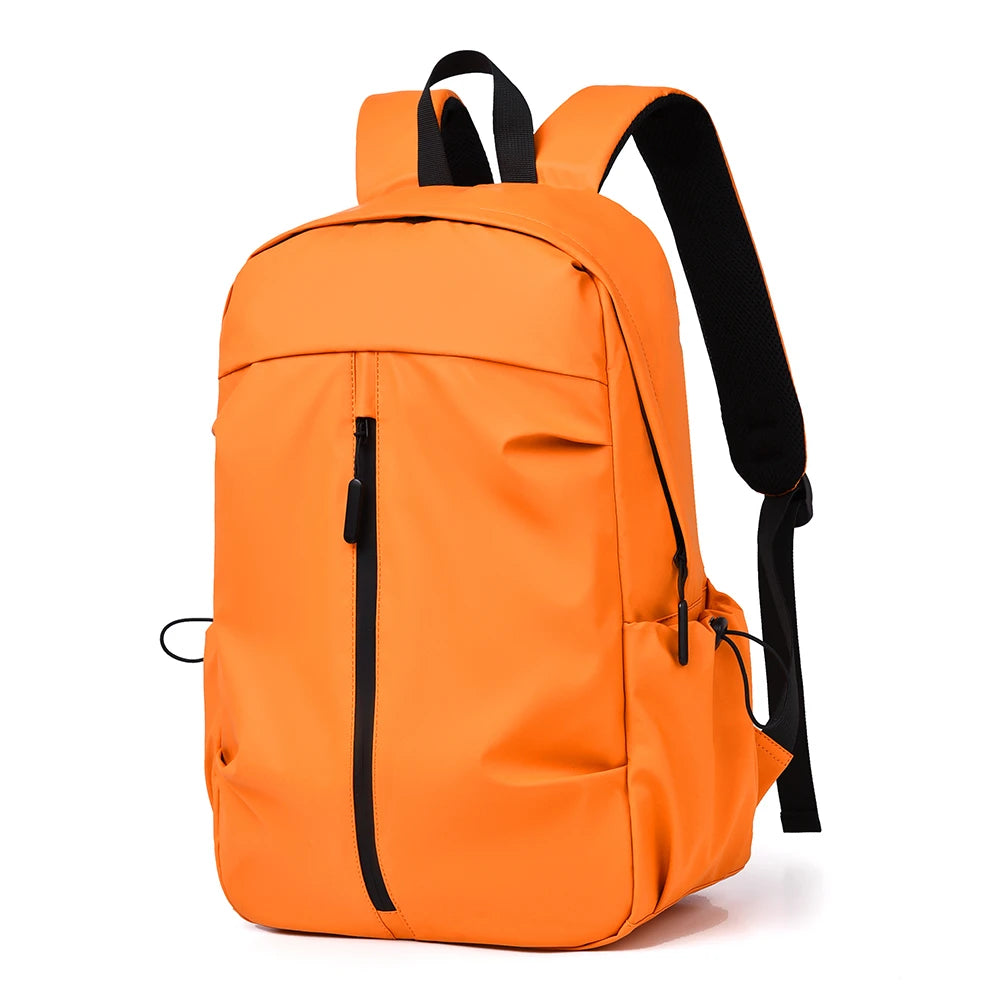 Orange backpack with black straps on a white background
