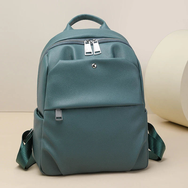Teal backpack on a beige background