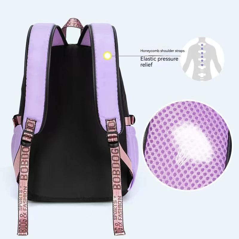 Purple backpack with honeycomb shoulder straps and elastic pressure relief features on a white background.